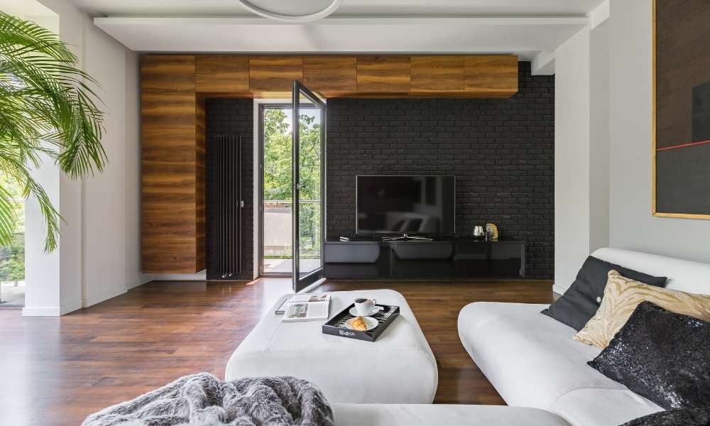 A Living Room With Fireplace on a Slanted Corner Wall