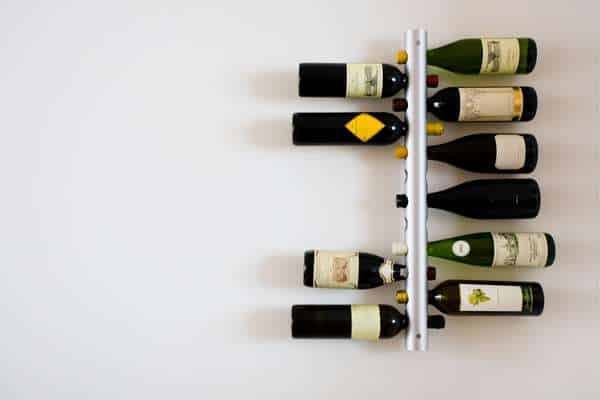 Separate A Dining Room With A Wine Rack 'Wall' To Zone The Space