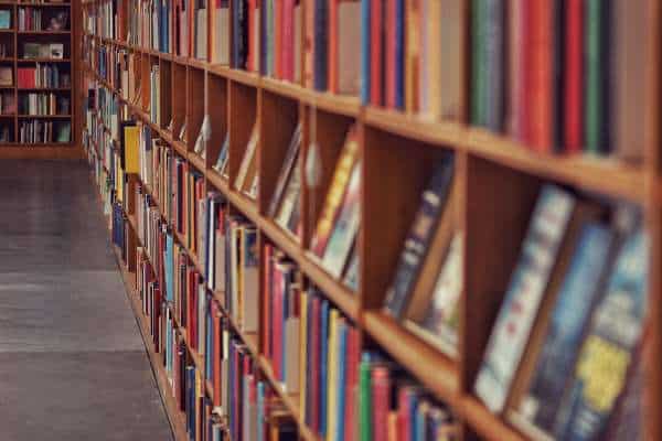 Arranging Books On The Shelf 